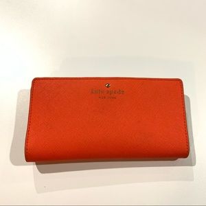 Kate Spade Slim Bifold Wallet in bright orange